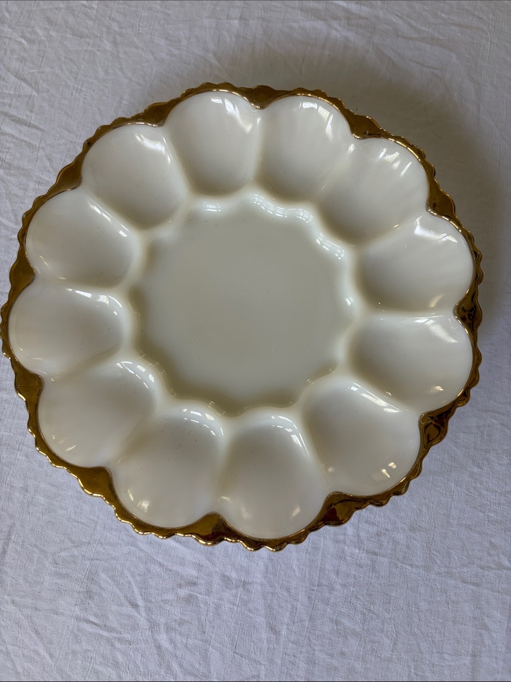 Vintage Anchor Hocking milk glass deviled egg platter with gold trim.